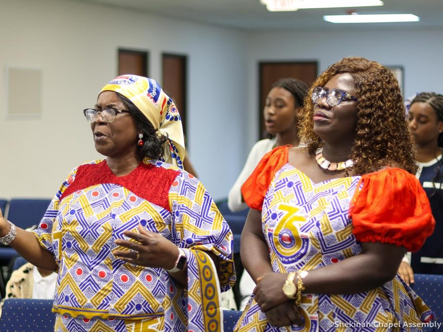Women of the assembly worshipping together during a Sunday service.